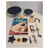 Anchor Hocking and Pyrex baking dishes with lids, cookbook, refrigerator magnets.
