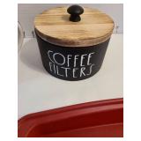 Red silicone baking dish, wooden coffee filter container, mug and more.