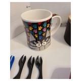 Red silicone baking dish, wooden coffee filter container, mug and more.