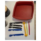 Red silicone baking dish, wooden coffee filter container, mug and more.