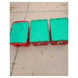 Three red and green holiday storage totes.