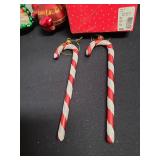 6 glass candy canes and Christmas ornaments.