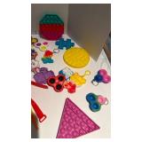 Pop it keychains and wristbands, nerf guns(no bullets) and more