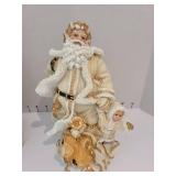 Resin Santas, 10 inches tall.