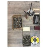 Lots of drill bits, a few nails, and a drain lining