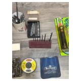 Lots of drill bits, a few nails, and a drain lining