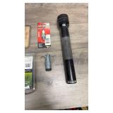 Ice scraper, flashlight (untested), spark plug, 4-flat 12