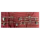 Box of clothing hangers - mostly plastic, a few pant hangers