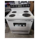 Vintage General Electric White Electric Range - function unknown, no power cord. 30" W x 26" D (including handle) x 44" H
