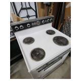 Vintage General Electric White Electric Range - function unknown, no power cord. 30" W x 26" D (including handle) x 44" H