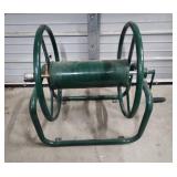 Large, Heavy Duty Metal Garden Hose Reel. Wall Mountable. Excellent condition!  Reel wheel is 16" W x 6" diameter. Frame is 31" W x 17" H x 24.5" D