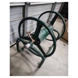 Large, Heavy Duty Metal Garden Hose Reel. Wall Mountable. Excellent condition!  Reel wheel is 16" W x 6" diameter. Frame is 31" W x 17" H x 24.5" D