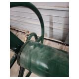 Large, Heavy Duty Metal Garden Hose Reel. Wall Mountable. Excellent condition!  Reel wheel is 16" W x 6" diameter. Frame is 31" W x 17" H x 24.5" D