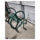 Large, Heavy Duty Metal Garden Hose Reel. Wall Mountable. Excellent condition!  Reel wheel is 16" W x 6" diameter. Frame is 31" W x 17" H x 24.5" D