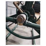 Large, Heavy Duty Metal Garden Hose Reel. Wall Mountable. Excellent condition!  Reel wheel is 16" W x 6" diameter. Frame is 31" W x 17" H x 24.5" D