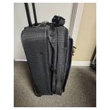 Ascot Carry-on Luggage on Wheels with telescoping handle with button activation - 15" W x 10" D x 22" H - Good clean condition.  has 2 gold locks on the zippers but no keys
