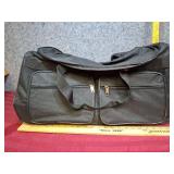 Black Rolling Duffle Bag with Multiple Compartments. 34"L x 12" W x 12" H.  Good clean condition