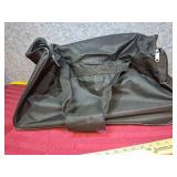 Black Rolling Duffle Bag with Multiple Compartments. 34"L x 12" W x 12" H.  Good clean condition