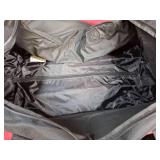 Black Rolling Duffle Bag with Multiple Compartments. 34"L x 12" W x 12" H.  Good clean condition