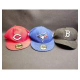 THREE New Era 59FIFTY fitted baseball caps, which are the official on-field caps for Major League Baseball teams. The caps represent different professional baseball teams.