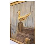 Handcrafted wooden wall art featuring a stylized seagull design. Three-dimensional effect created with stepped wooden blocks. Framed ready to hang. 31 inches by 24 inches