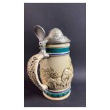 Avon 1990 Decorative Elephant Scene Beer Stein with Lid. Approximately 5.5 inches tall