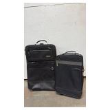 Black Rolling Luggage - 2 Pieces Smaller is 20 inches tall.