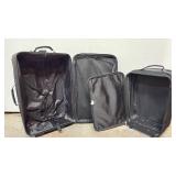 Black Rolling Luggage - 2 Pieces Smaller is 20 inches tall.