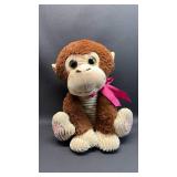 Plush Monkey with Pink Bow. Approximately 16 inches tall