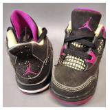 Air Jordan 4 Retro infant/toddler shoes in a black, fuchsia flash, and liquid lime color scheme. Size 5c