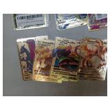 APPEARS NEW - 7 Piece Gold Metal Pokemon Cards-Ancient Mewtwo, Arceus VMAX (Blue), Arceus VMAX (Red), Charizard V, VMAX Venusaur, Charizard & Blastoise Tagteam, Charizard VMAX, and Charizard DX- UNAUT