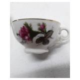 Porcelain Tea Set with Rose Pattern and Gold Trim, 3 cups, 4 saucers