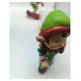 Holiday Decor of: Wooden merry go round with working music box; 2 Elves, NASCAR #8 Dale Jr., Hallmark train ornament. 5 items in lot