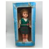 German Made Vinyl Doll in Plaid Uniform, in original box, Vintage.