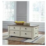Signature Design by Ashley Bolanburg 4 Drawer Coffee Table with Lift Top  Two-tone Brown - Some Scratches & Missing Wheel  - Retail: $759