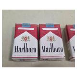 3 unopened packs of Marlboros