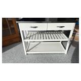 White kitchen island with metal top and 2 drawers 33x44x21 has electrical outlet