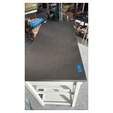 White kitchen island with metal top and 2 drawers 33x44x21 has electrical outlet