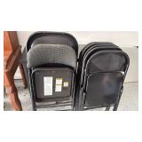 7 Costco steel folding chairs (one padded)