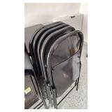 7 Costco steel folding chairs (one padded)