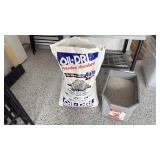 Oil Dry premium absorbent 3/4 full and Rubbermaid bucket with cat litter