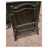 Electric fireplace heater, located in basement