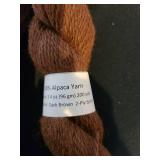 12 skeins 100 pct. 2-ply sport Alpaca yarn, appx. 200 yards, dark brown color