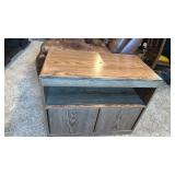 TV stand 25x29x15.5 located in basement