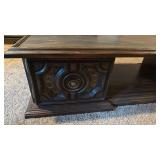 Coffee table with side storage 15x60x24 located in basement