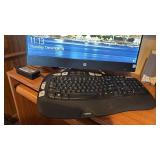 HP all in one computer with Intel Core 13, Logitech keyboard and speakers located in basement