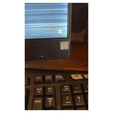 HP all in one computer with Intel Core 13, Logitech keyboard and speakers located in basement
