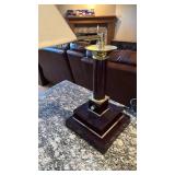 Desk lamp with electrical outlets and telephone jacks 25x8.5x8.5 located in basement