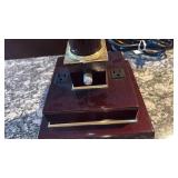 Desk lamp with electrical outlets and telephone jacks 25x8.5x8.5 located in basement