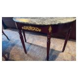Half moon entry table with stone top 31x47x21.5 located in basement